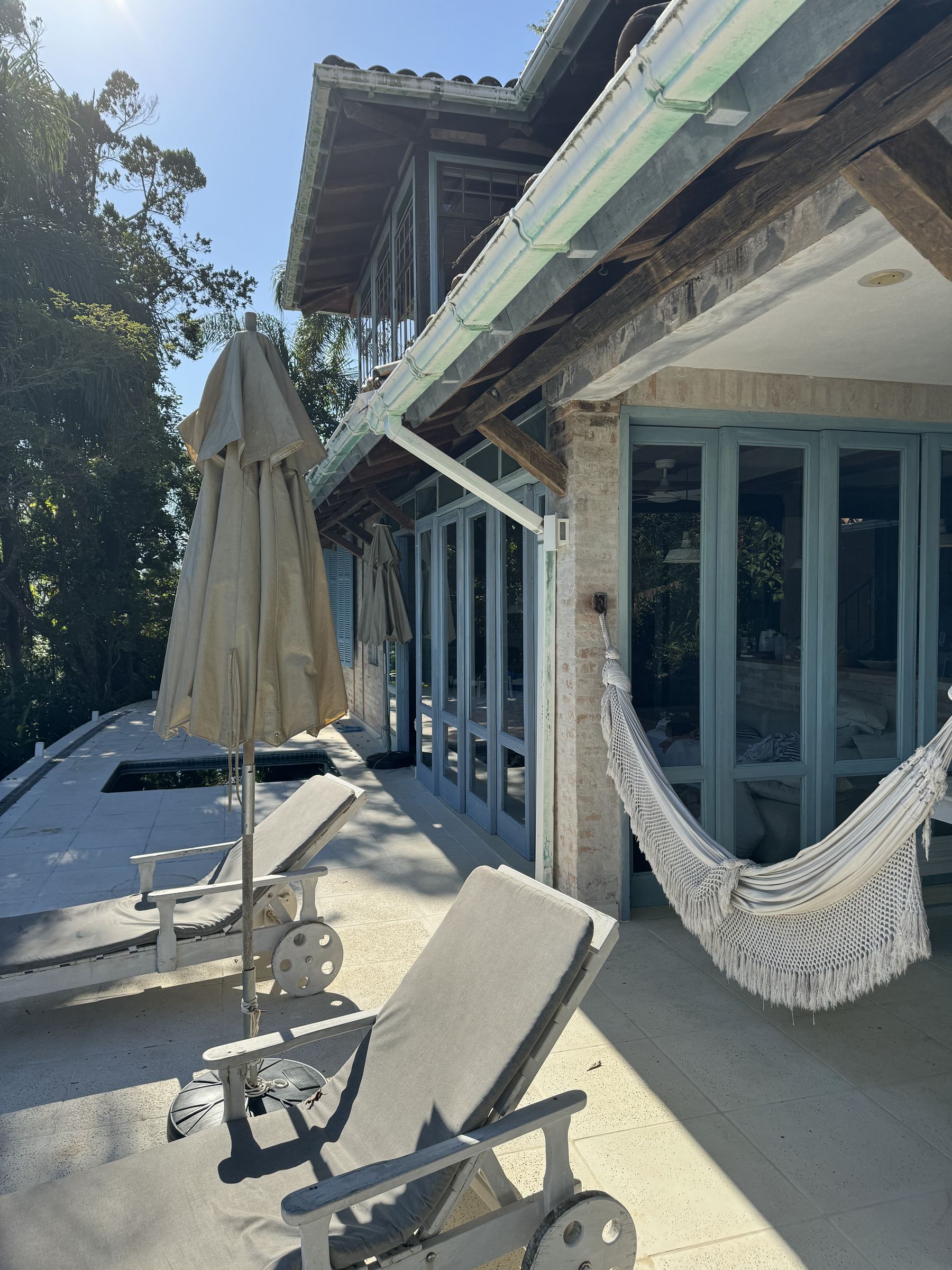 Hammock and loungers on the white terrace