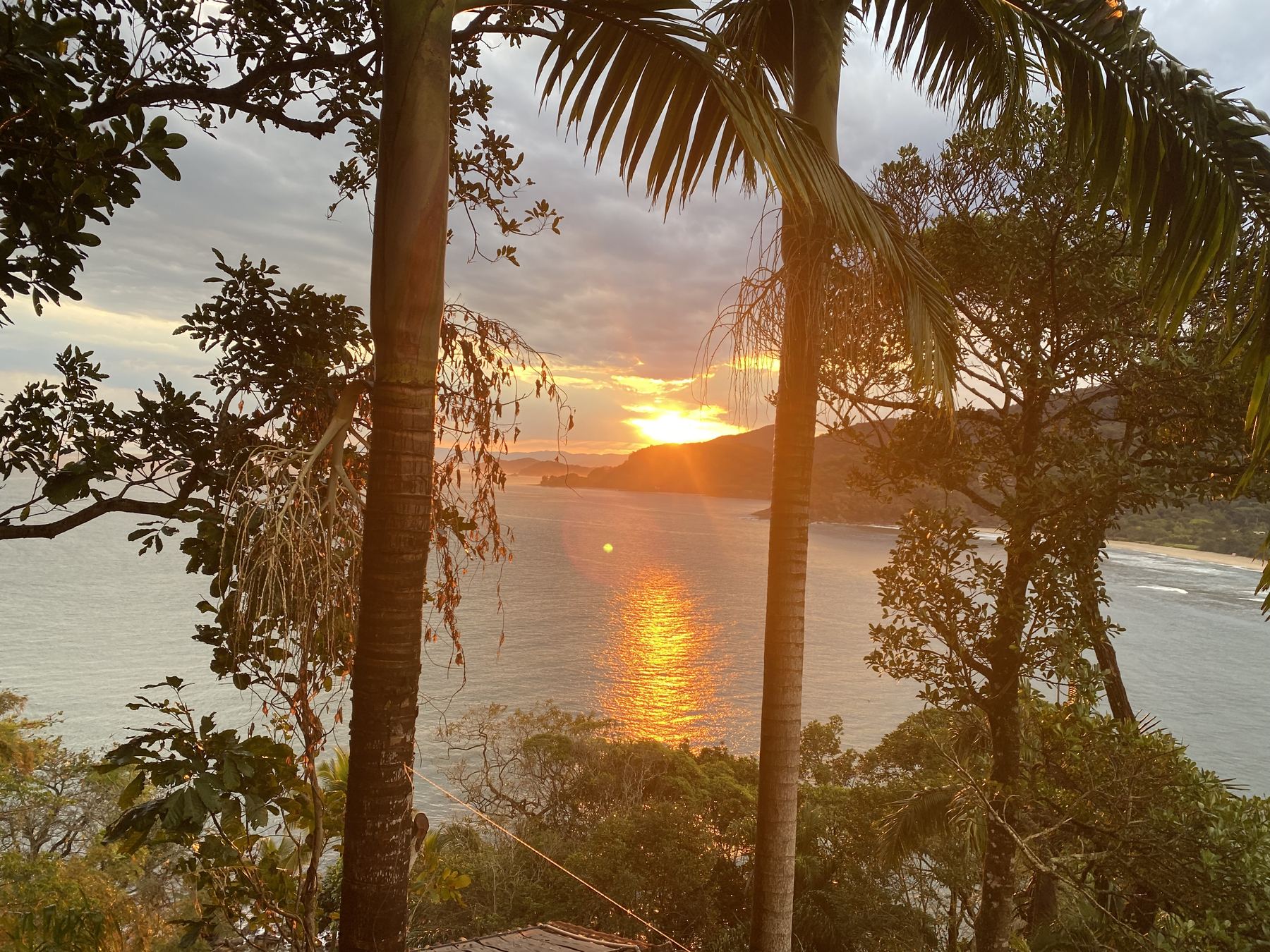 Golden sunset over the sea at Barra do Sahy